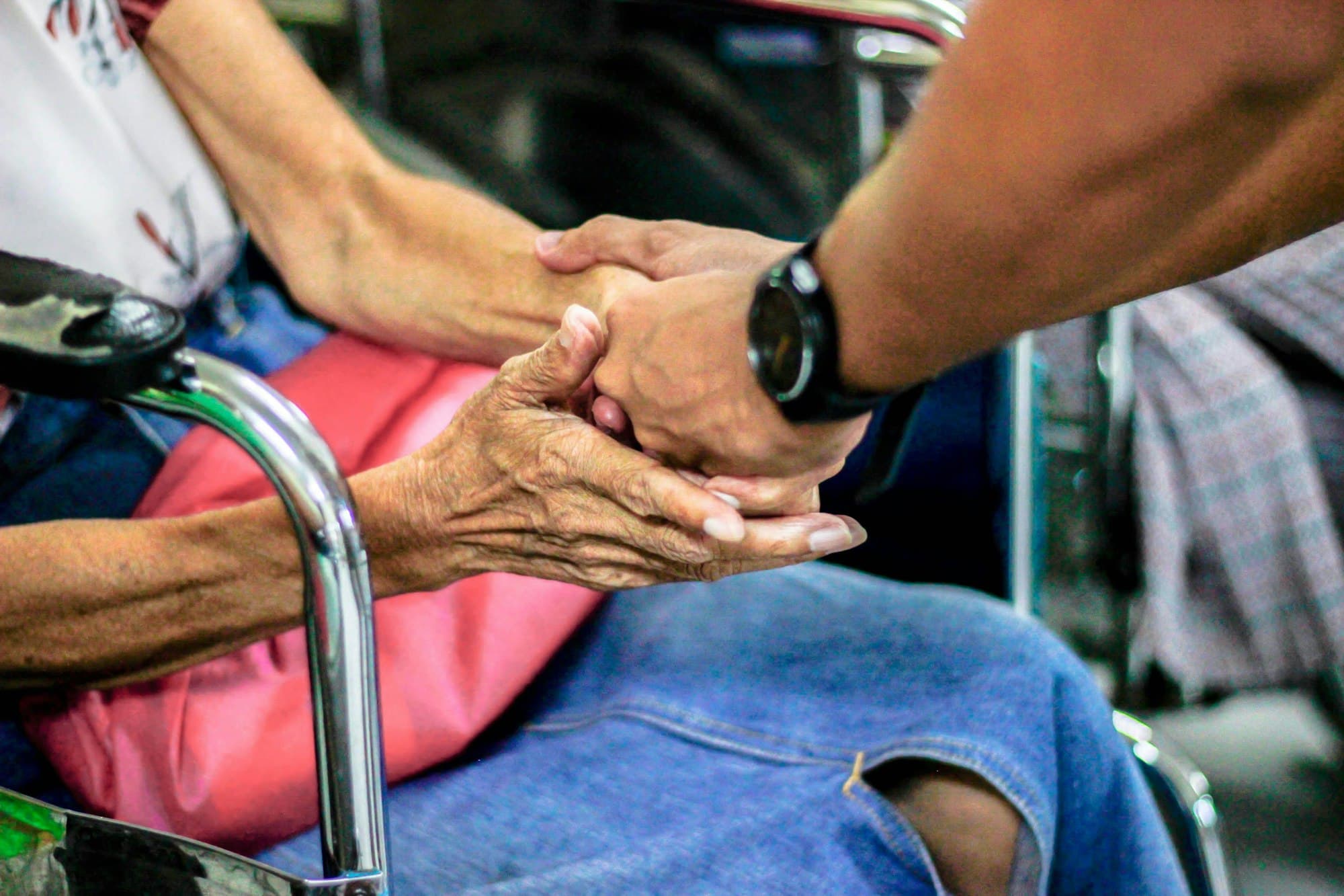 Hands held together in a gesture of trust and support